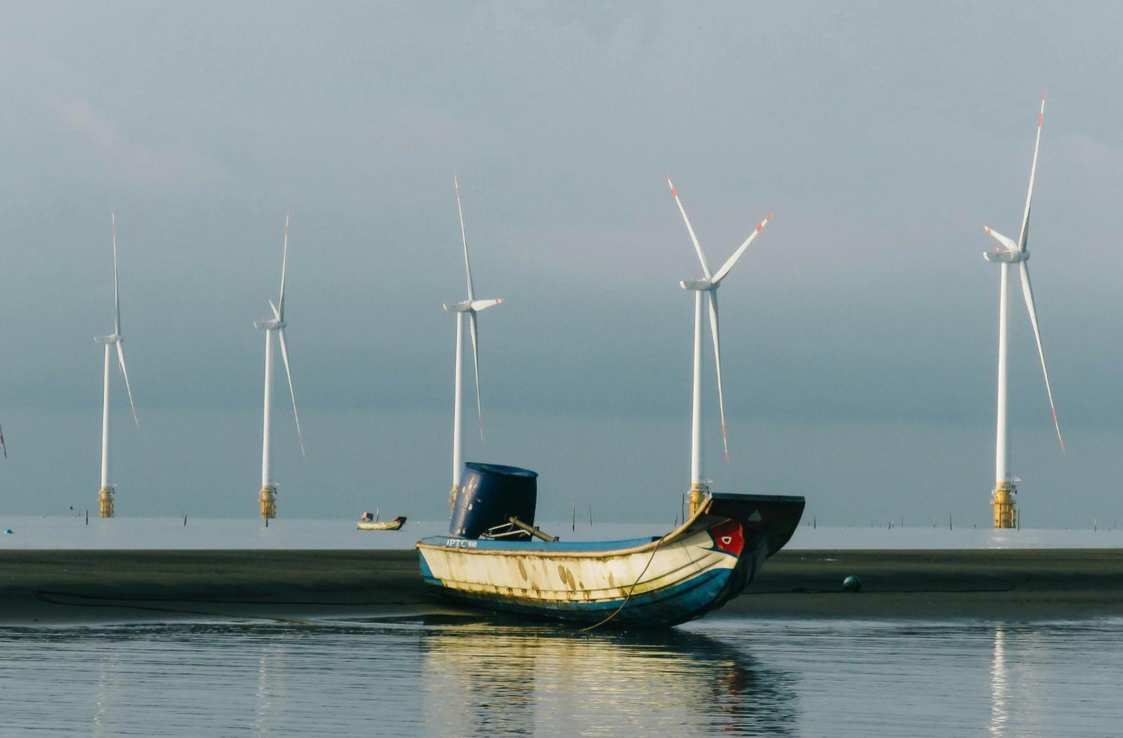 Solar panel in local area with fishing boat