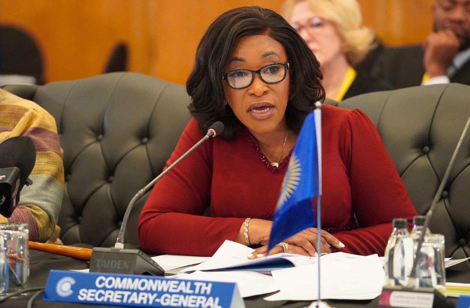 Commonwealth Secretary-General speaking into microphone at the Commonwealth Trade Ministers Meeting