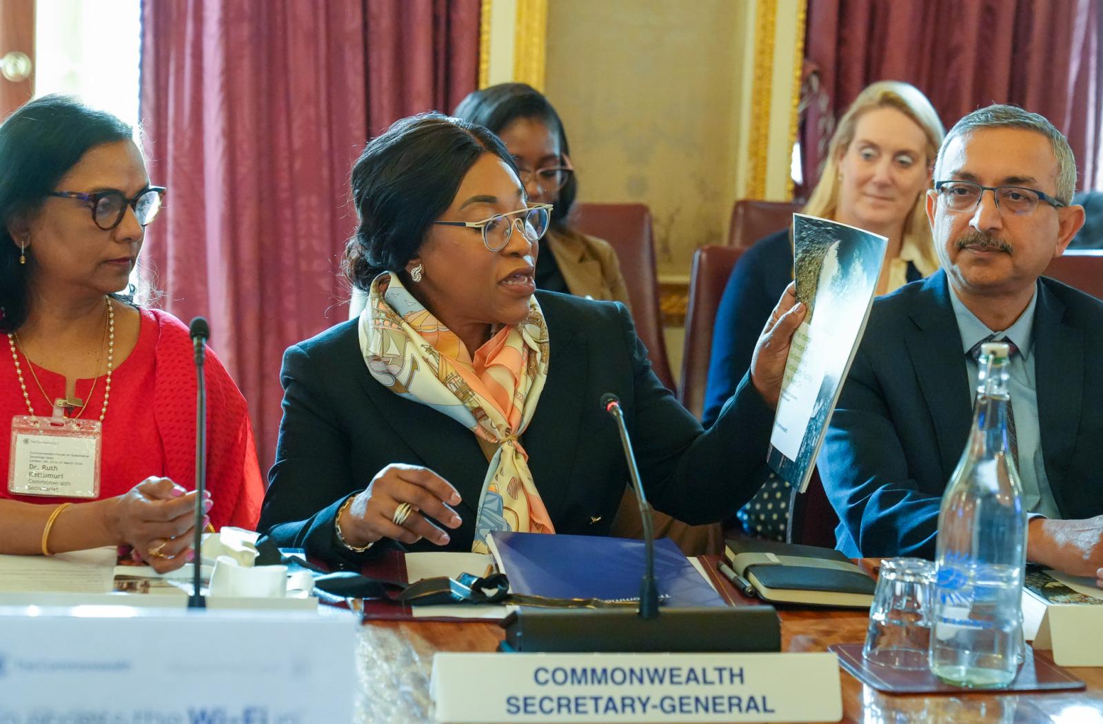 Hon Shirley Botchwey holding a report at the Commonwealth Forum of Sustainable Sovereign Debt