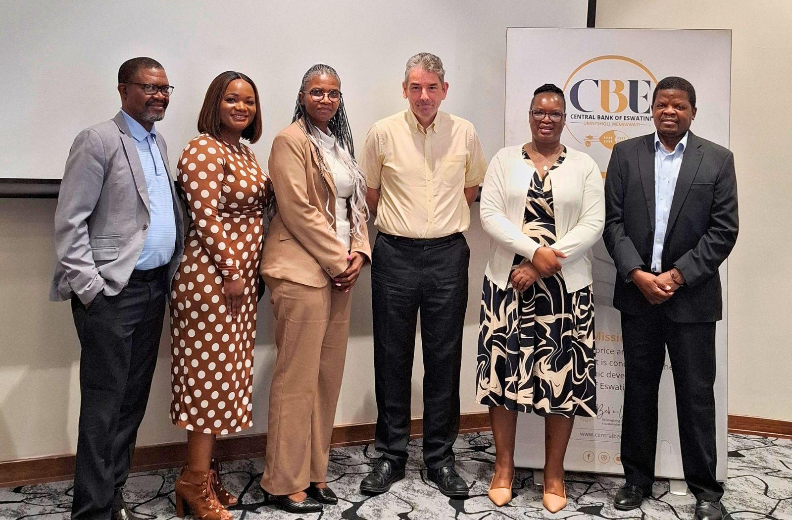 A group photo of Mac Banda with Eswatini debt officials