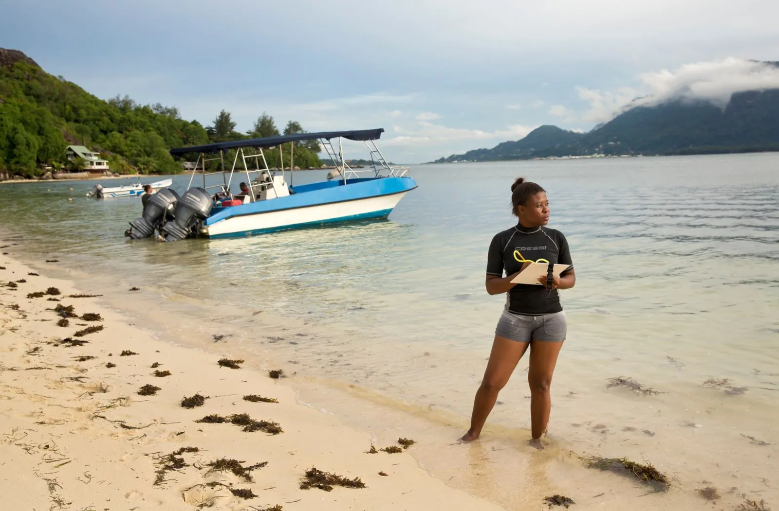 A woman maps coral reefs around Mahe Island in Seychelles