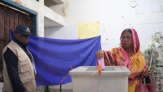 H.E. Nana Akufo-Addo, former President of the Republic of Ghana watches as a woman makes her vote during the Bangladesh 2026 parliamentary elections