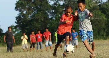 Children playing football in Malaysia