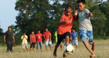 Children playing football in Malaysia