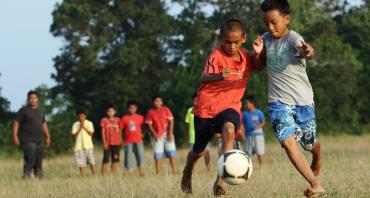 Children playing football in Malaysia