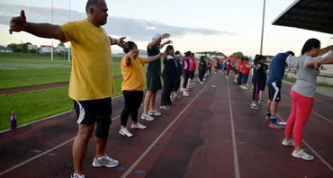 People doing stretches at a sport boot camp