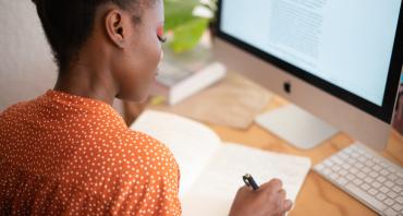 Woman writing in notebook