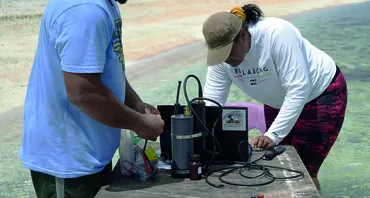 Two researchers monitoring ocean acidification in the Pacific Islands 