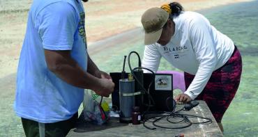 Two researchers monitoring ocean acidification in the Pacific Islands 