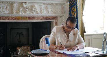 Secretary-General signing the MOU