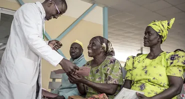 A doctor talking to patients