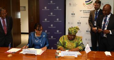 Secretary General of the Commonwealth and Director General signing the MoU