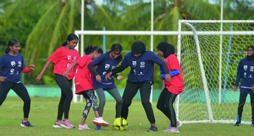 Girls playing football in the Maldives