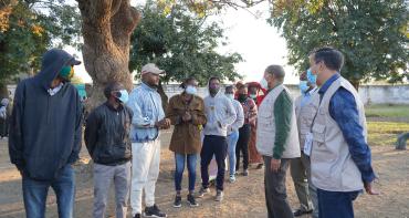 People wait to cast their vote in the 2021 general elections in Zambia