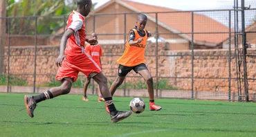 Two boys playing football