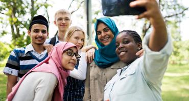 A group of young people taking a selfie