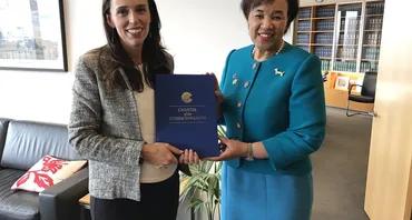 Secretary-General of the Commonwealth, The Rt Hon Patricia Scotland KC, presents the Commonwealth Charter to the former Prime Minister of New Zealand, Jacinda Ardern.