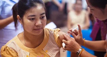 A woman receiving an influenza vaccination