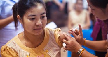 A woman receiving an influenza vaccination