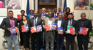 Group photo of stakeholders with publications