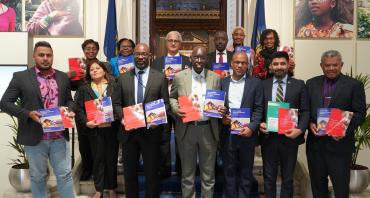 Group photo of stakeholders with publications