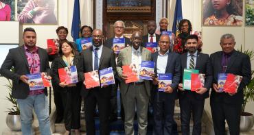 Group photo of stakeholders with publications