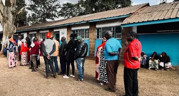 Voters wait to cast their vote in the 2022 Kenya general elections
