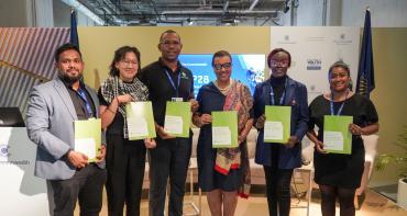 Youth leaders and Commonwealth Secretary-General at COP28