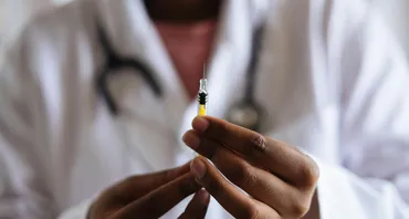 Nurse holding a neede