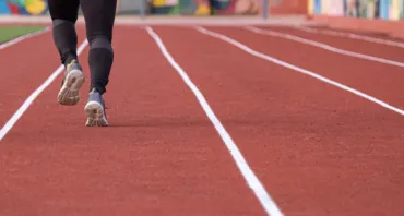 Person running on a track