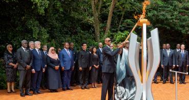 Rwandan President Paul Kagame lights a memorial flame at the Kigali Genocide Memorial