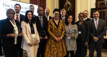 lawyers and award winners gather around SG for a photo 