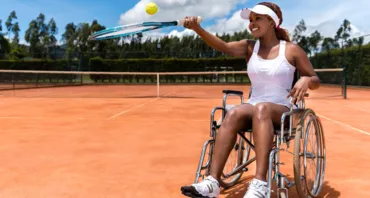Paralympian plays tennis