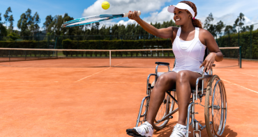 Paralympian plays tennis