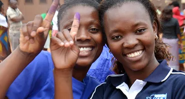 young voters smile at the camera