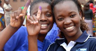 young voters smile at the camera