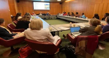 The World Cancer Congress Meeting people sat around table