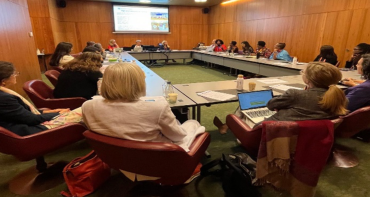 The World Cancer Congress Meeting people sat around table
