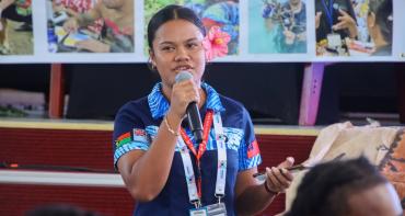 Young woman delegate speaking at the Commonwealth Youth Forum