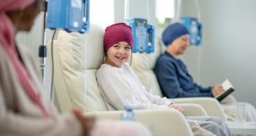 Child with cancer smiling