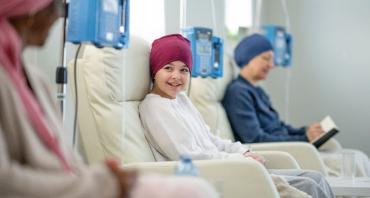 Child with cancer smiling