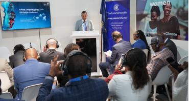 People sitting listening to someone present