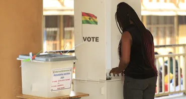 A voter casts her ballot in the 2024 Ghana elections 