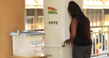 A voter casts her ballot in the 2024 Ghana elections 