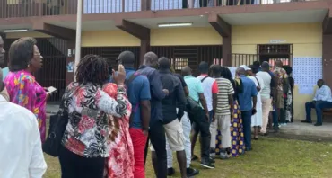 People queue to cast their vote in the Gabon Constitutional Referendum