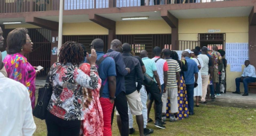 People queue to cast their vote in the Gabon Constitutional Referendum