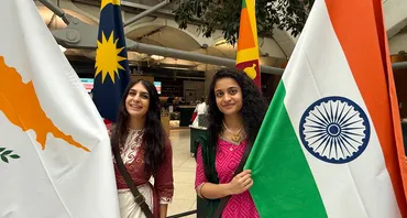 Two flagbearers at the Commonwealth flag raising in UK Parliament