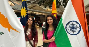 Two flagbearers at the Commonwealth flag raising in UK Parliament