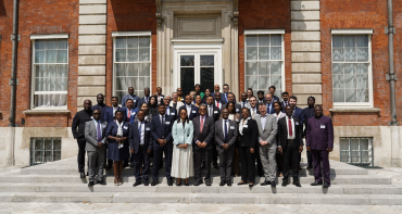 Group photo of delegates at the 4th Commonwealth Sustainable Energy Forum on the stairs of Marlborough House
