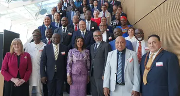 Standing group shot of Commonwealth Health Ministers and Secretary General Botchwey